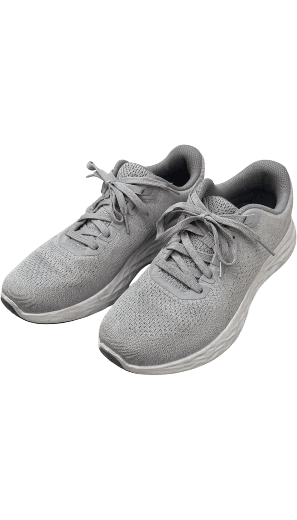 Pair of gray sneakers cut out on a white background after cleanup