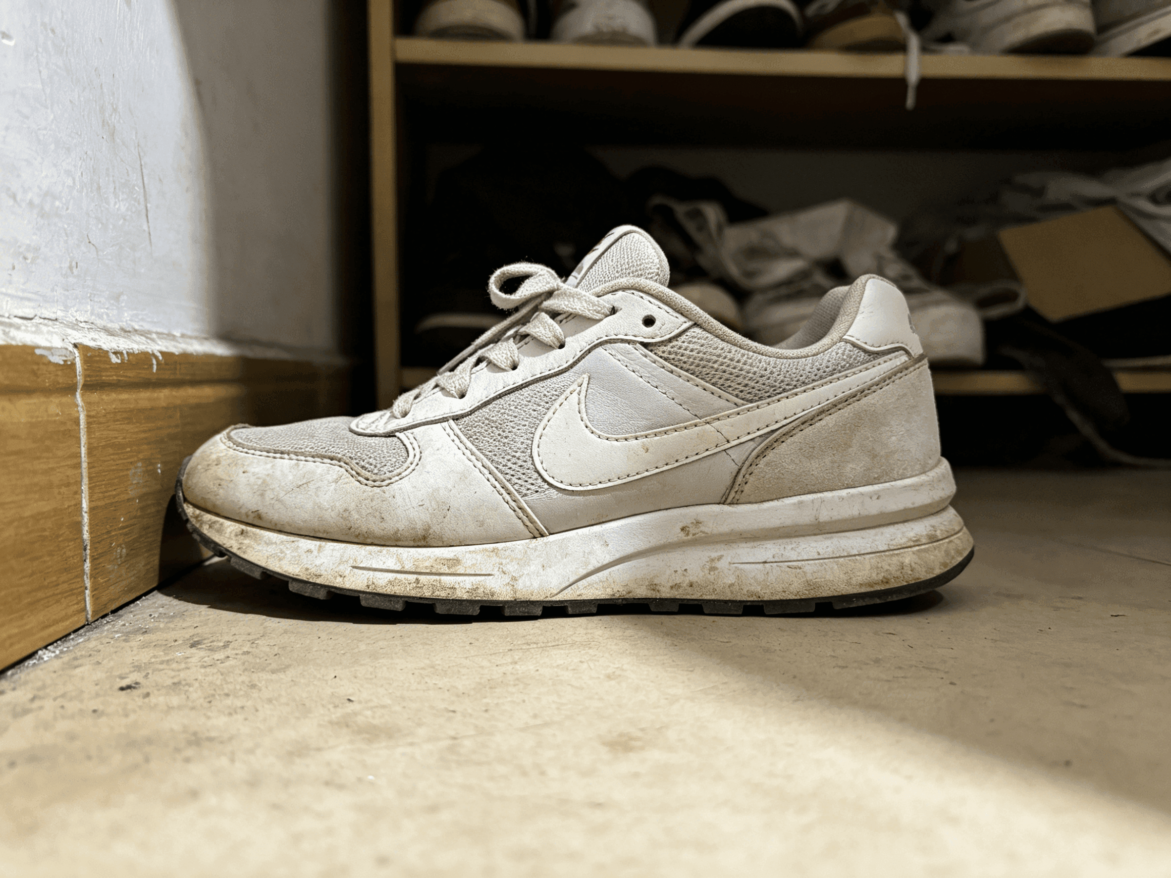 Sneaker photographed on a shelf before background cleanup